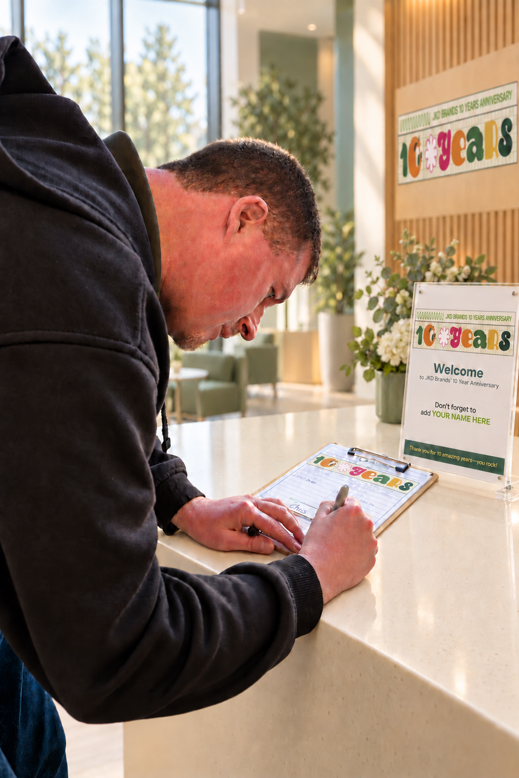 Guest signing in at a corporate anniversary reception